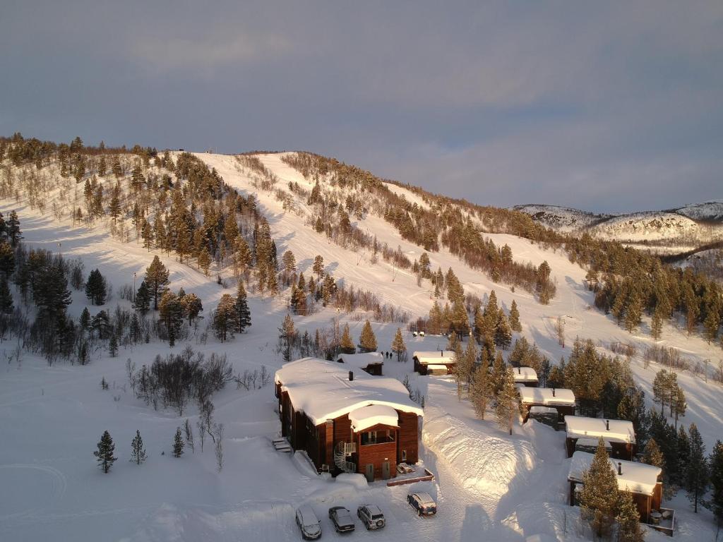 a building in the snow on a snowy mountain at Bjørnfjell Mountain Lodge in Alta