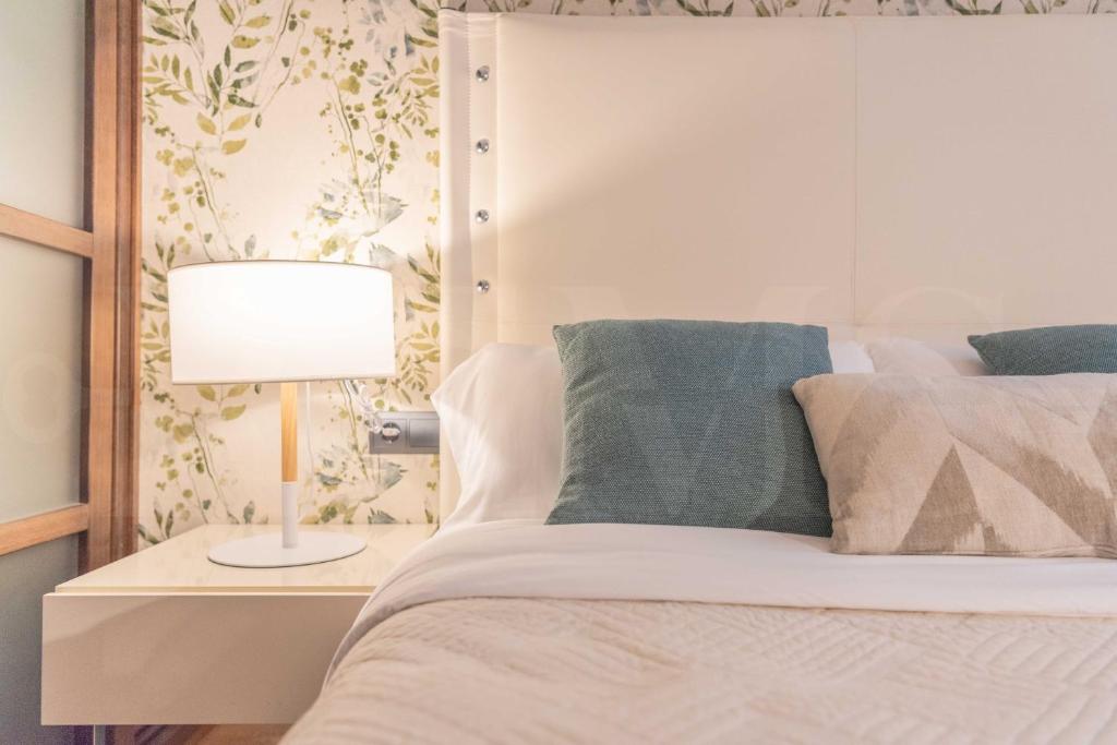Posteľ alebo postele v izbe v ubytovaní Cozy apartment in the heart of Malaga by REMS