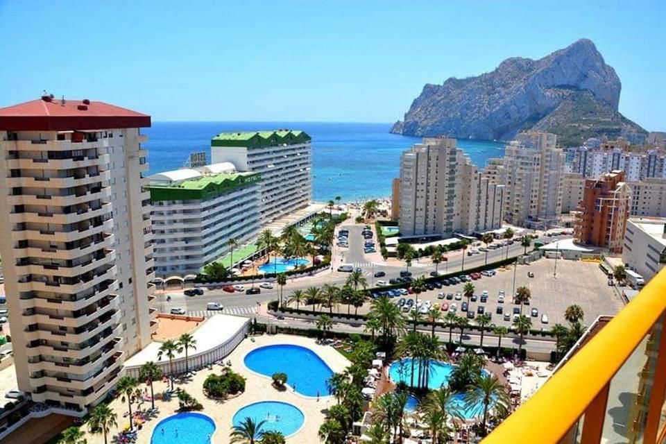 a view of a city with buildings and the ocean at ROCASOL - Beach in Calpe