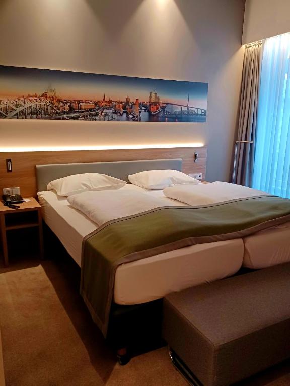 Postel nebo postele na pokoji v ubytování Hotel Panorama Hamburg-Harburg