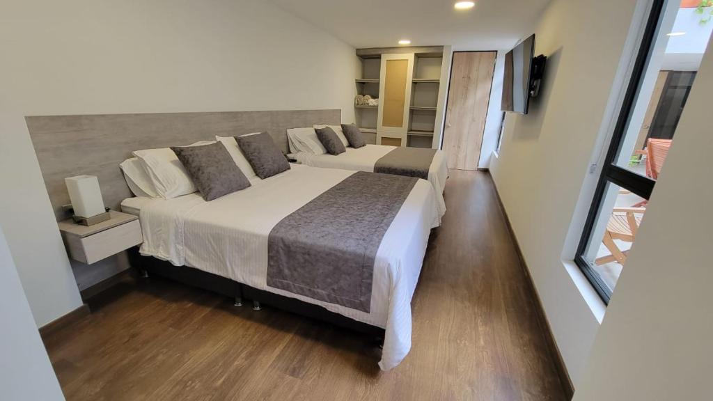Postel nebo postele na pokoji v ubytování Hotel Piedras De Maní