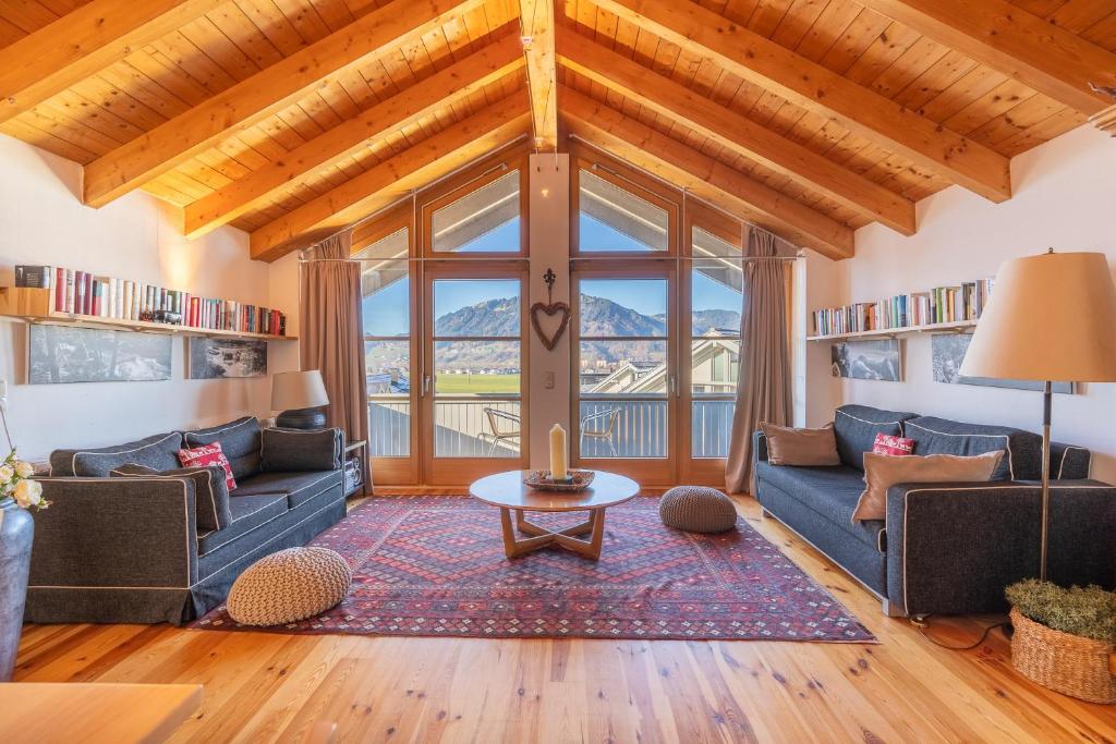 a living room with couches and a table at Mein Lieblingsort in Burgberg