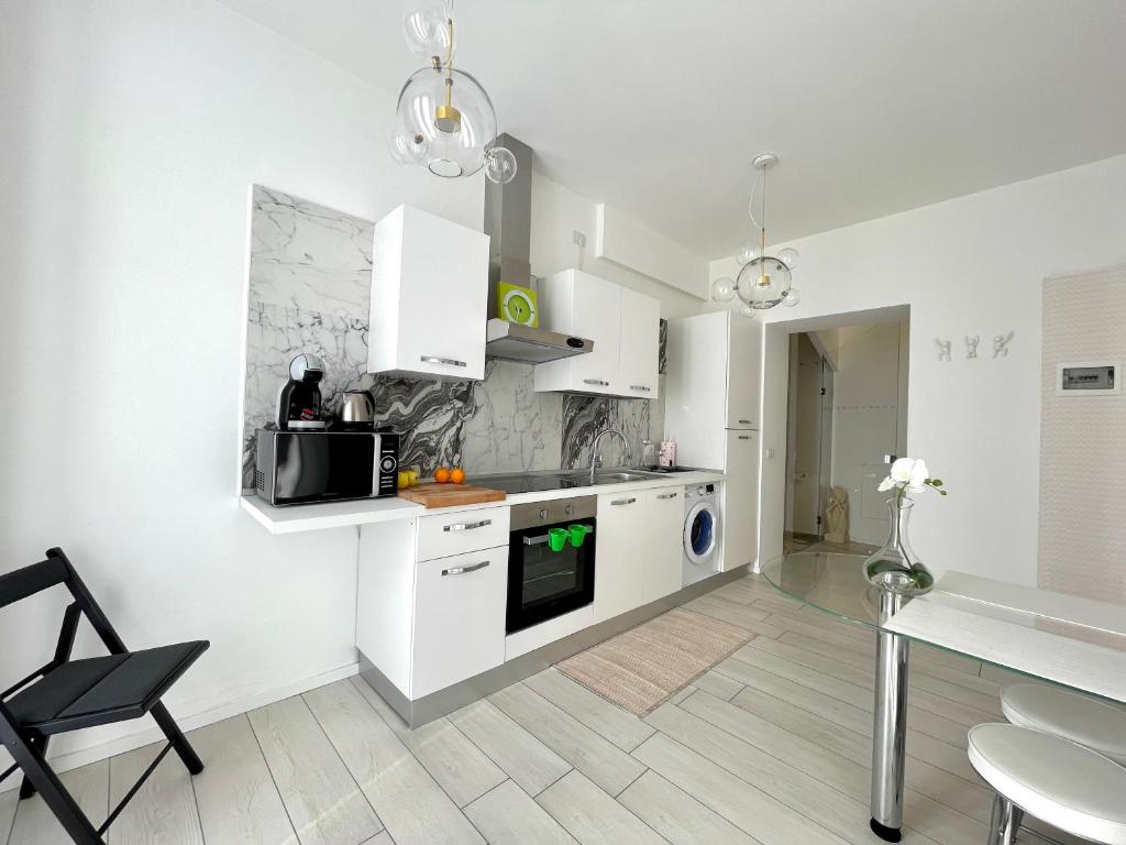 Kuchyňa alebo kuchynka v ubytovaní Mariarosa Suites