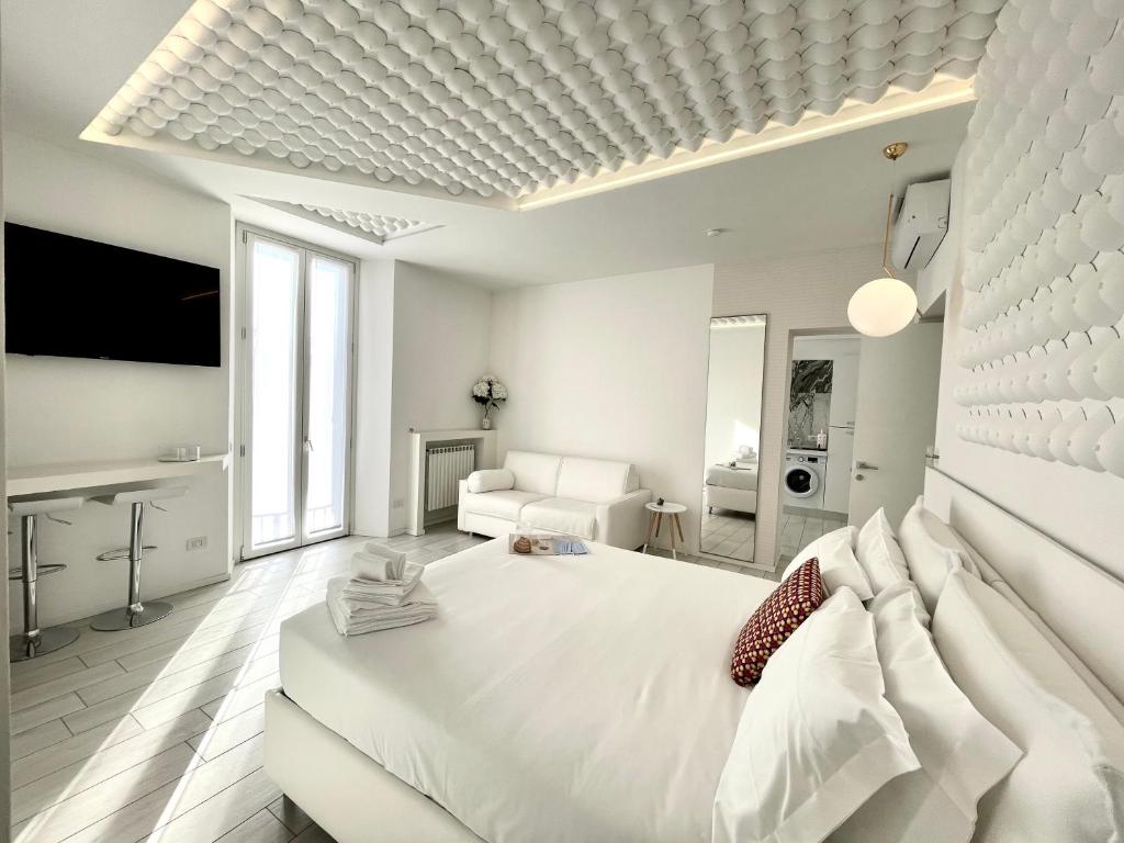 Posteľ alebo postele v izbe v ubytovaní Mariarosa Suites