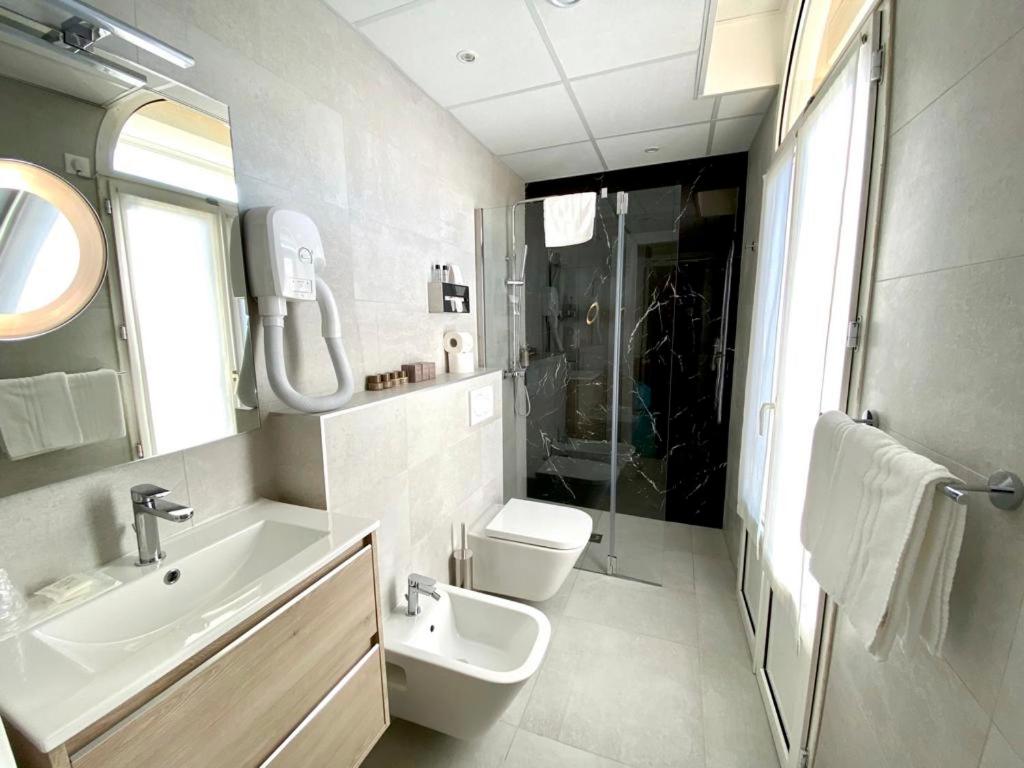 Koupelna v ubytování Hotel Olympia