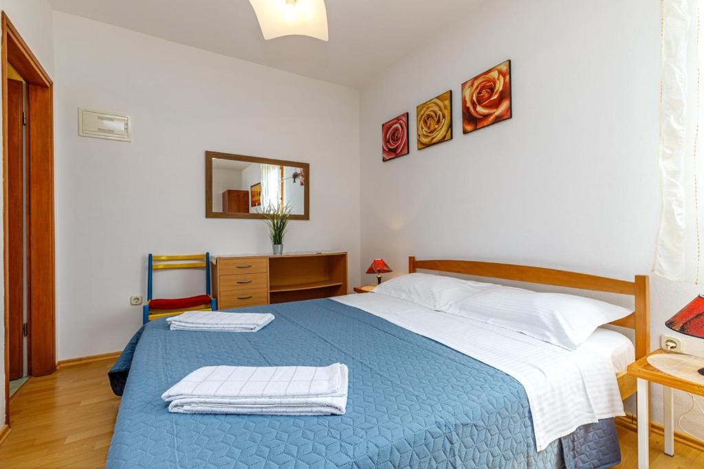 Postel nebo postele na pokoji v ubytování Apartments Pernar