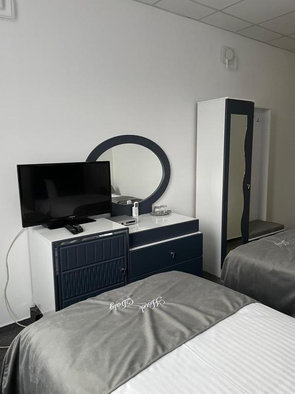 Postel nebo postele na pokoji v ubytování Hotel Daly
