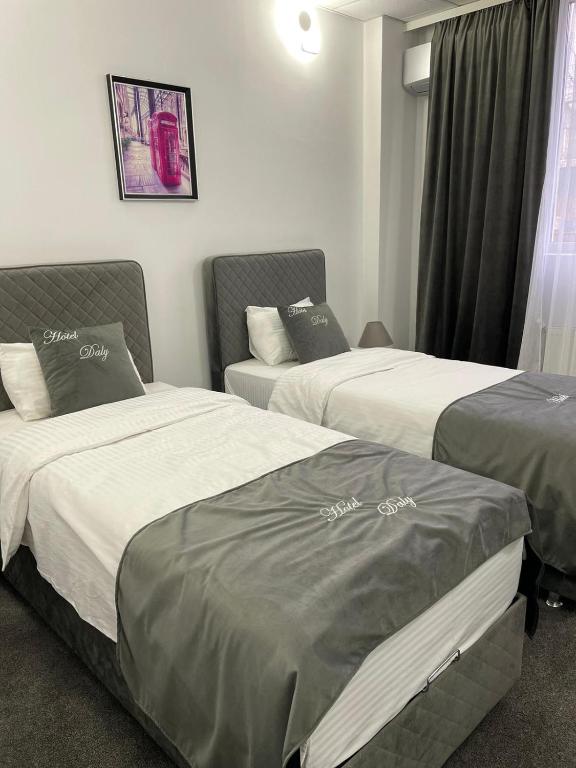 Postel nebo postele na pokoji v ubytování Hotel Daly