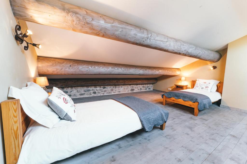 Postel nebo postele na pokoji v ubytování Gîte de Beauregard - Les Fermes Ardéchoises