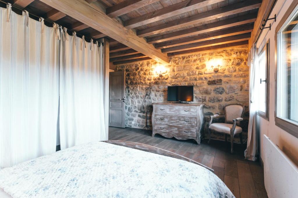 Postel nebo postele na pokoji v ubytování Gîte de Beauregard - Les Fermes Ardéchoises