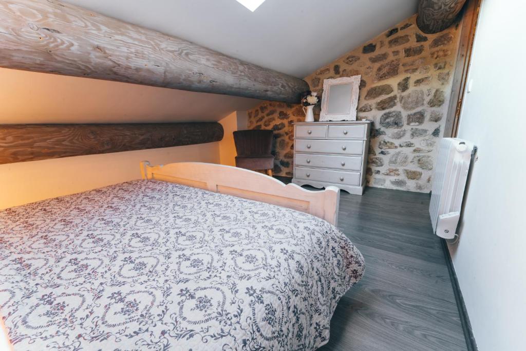 Postel nebo postele na pokoji v ubytování Gîte de Beauregard - Les Fermes Ardéchoises