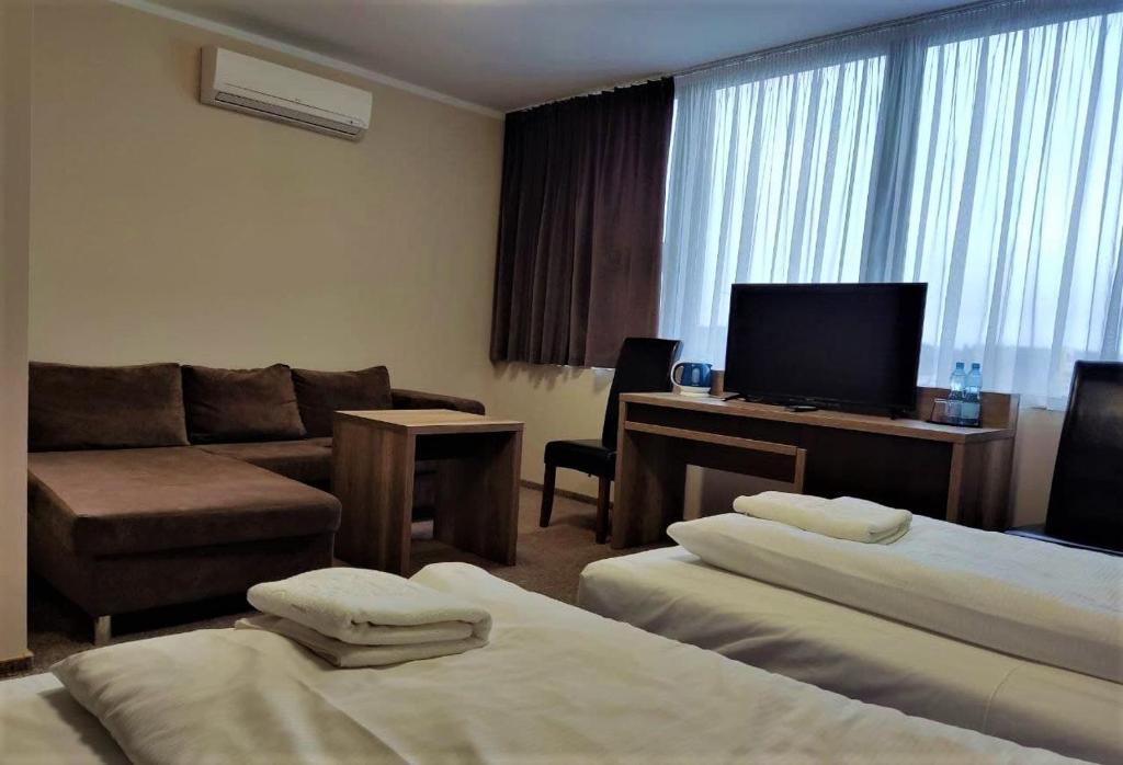 Postel nebo postele na pokoji v ubytování Hotel Cargo