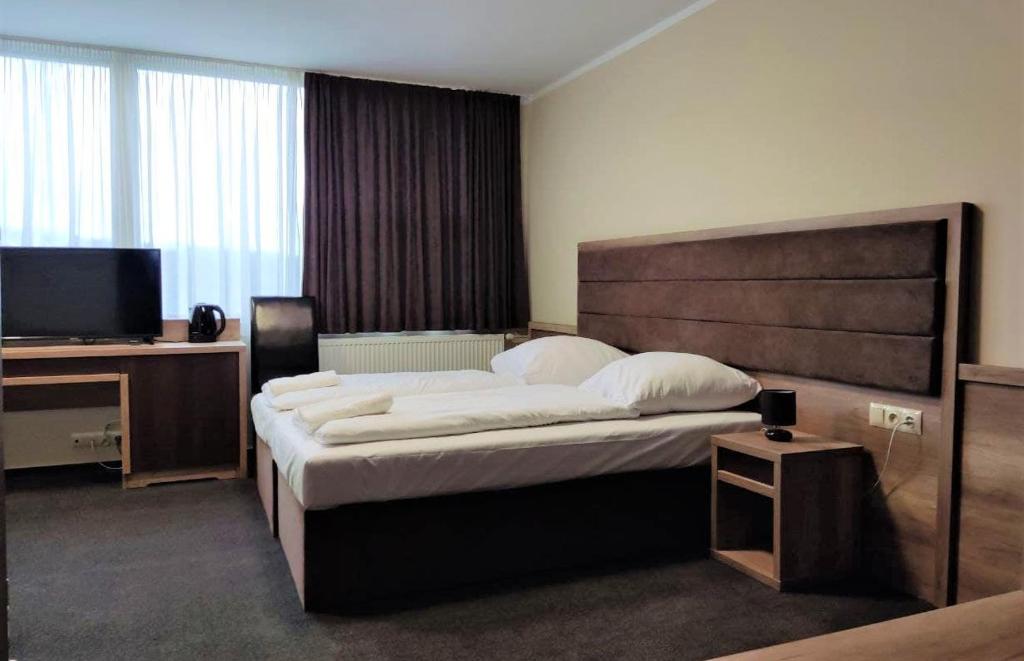 Postel nebo postele na pokoji v ubytování Hotel Cargo