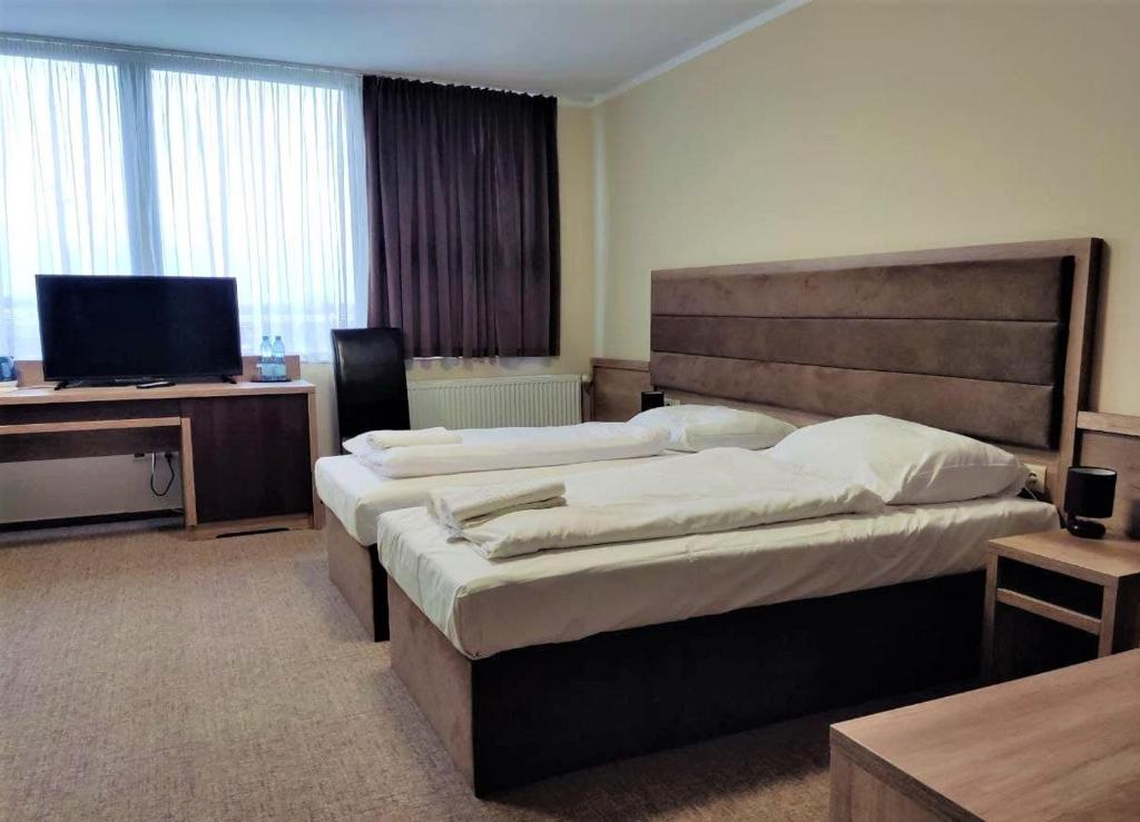 Postel nebo postele na pokoji v ubytování Hotel Cargo