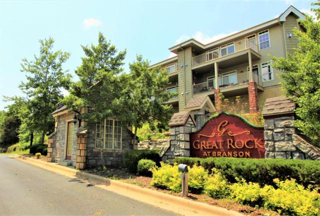 a large building with a sign in front of it at Great Rock Resort at Branson in Branson