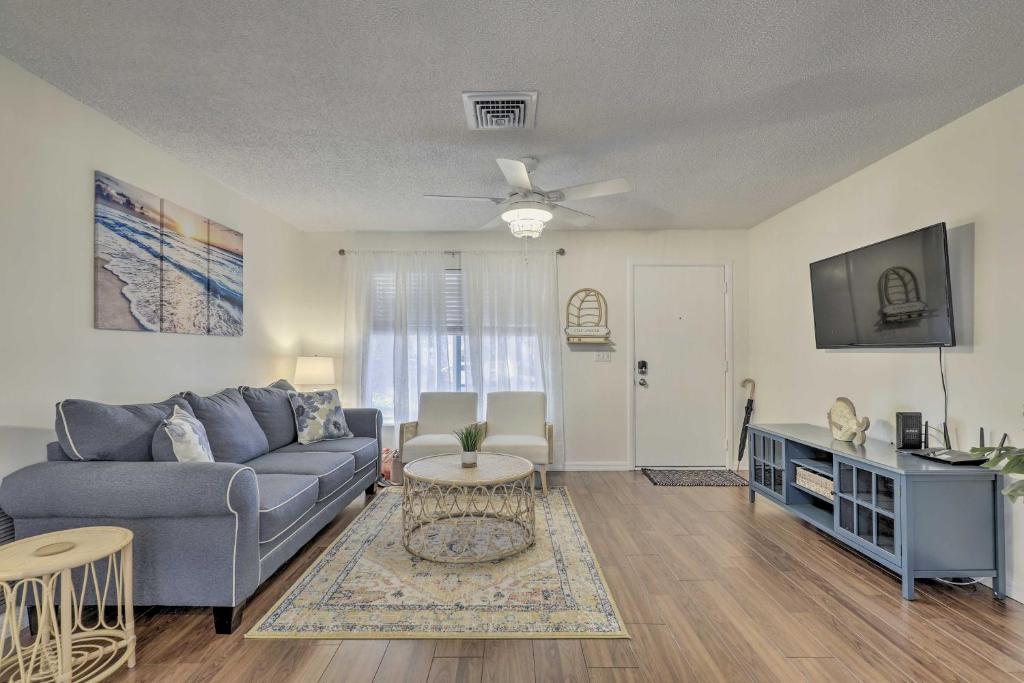 a living room with a couch and a table at Calming Getaway 9 Mi to Clearwater Beach! in Clearwater