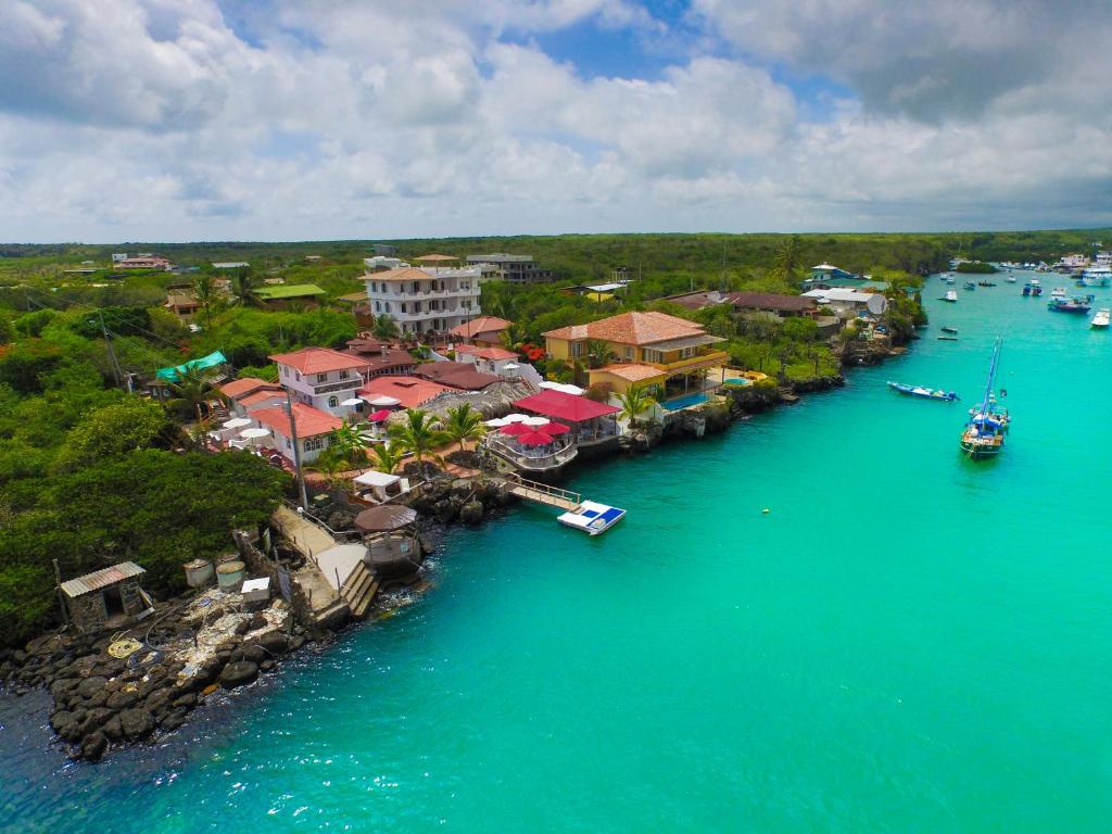 an aerial view of a resort on the water at Hotel Angermeyer Waterfront Inn in Puerto Ayora