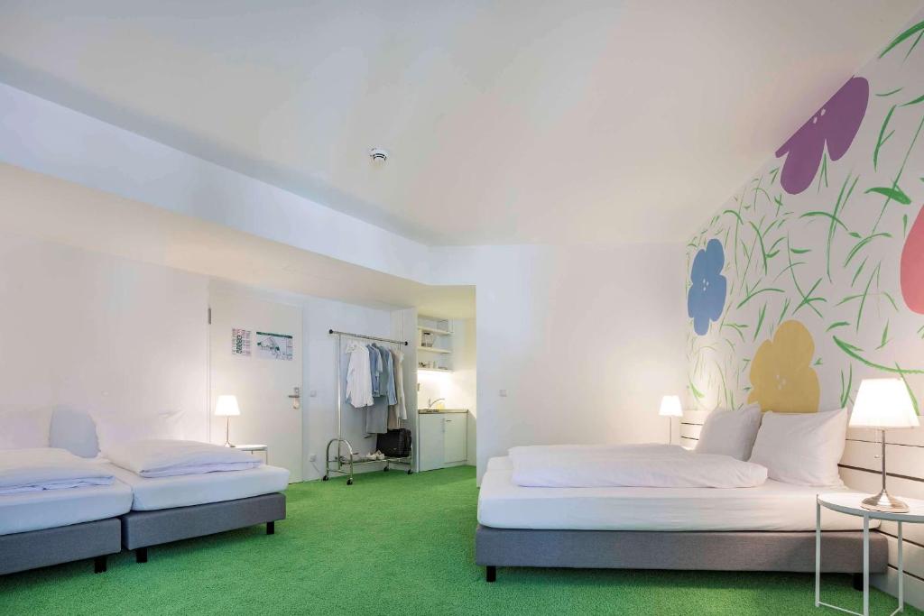 Postel nebo postele na pokoji v ubytování Flowers Hotel Münster