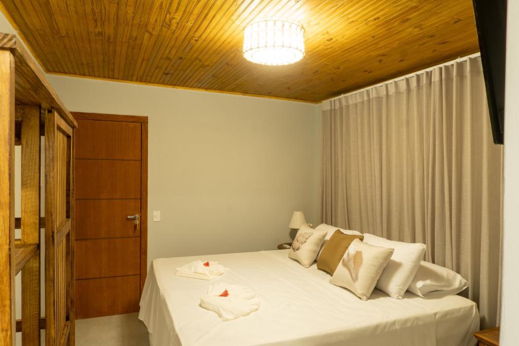 Postel nebo postele na pokoji v ubytování Tropical Beach