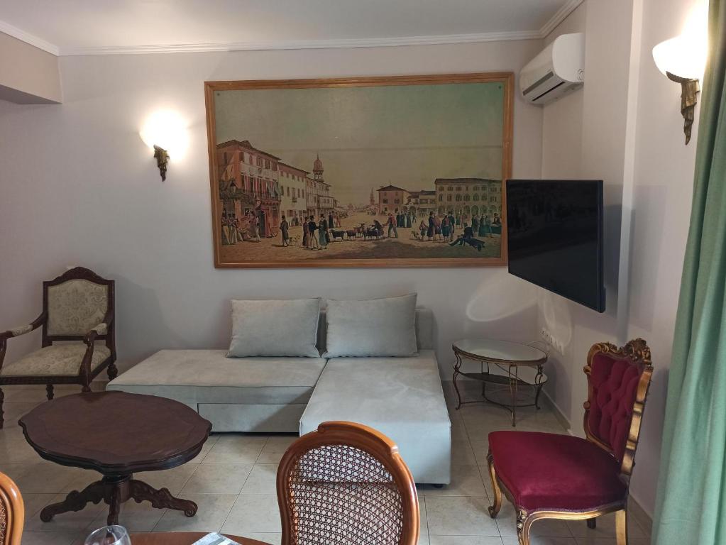 a living room with a couch and a table at OLD ZAKYNTHOS GALLERY GIO 2 in Zakynthos