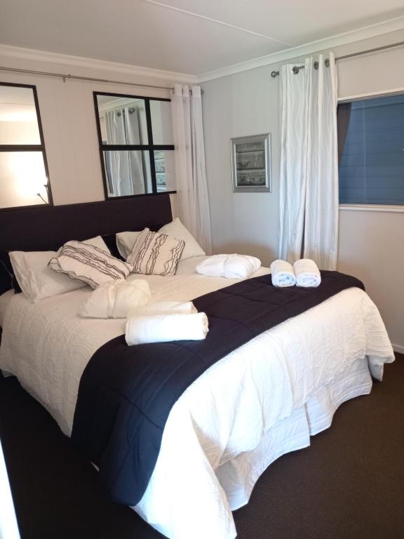 Ein Bett oder Betten in einem Zimmer der Unterkunft Beach House