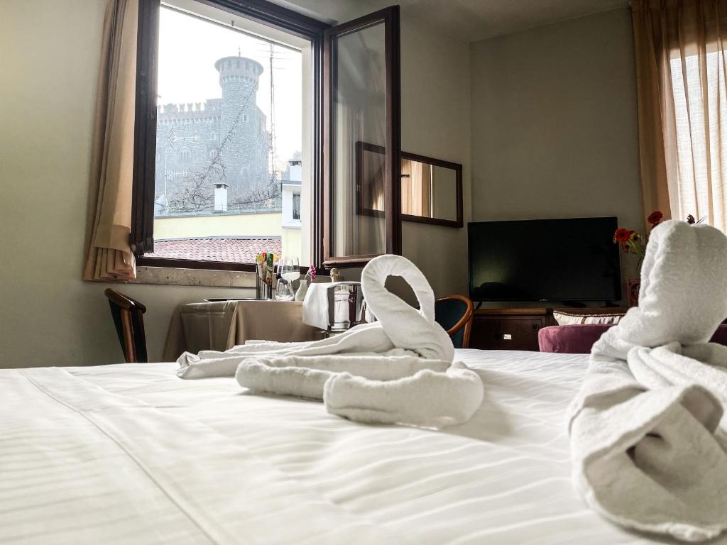 Posteľ alebo postele v izbe v ubytovaní Hotel Elefante