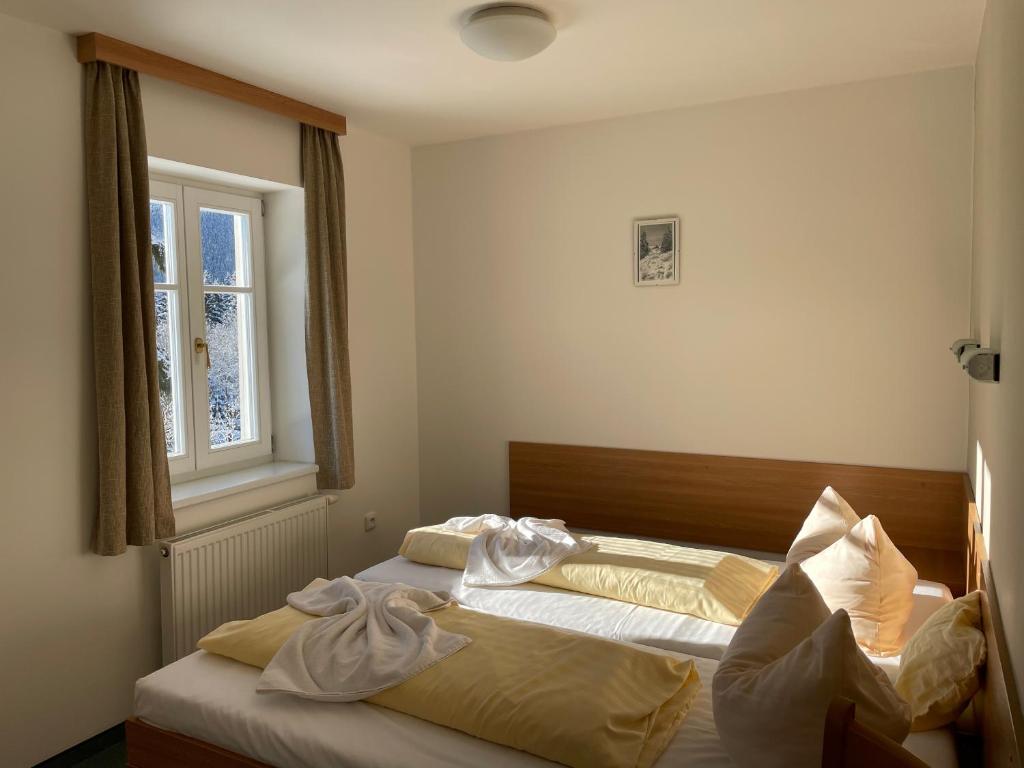 Postel nebo postele na pokoji v ubytování Hotel Děvín