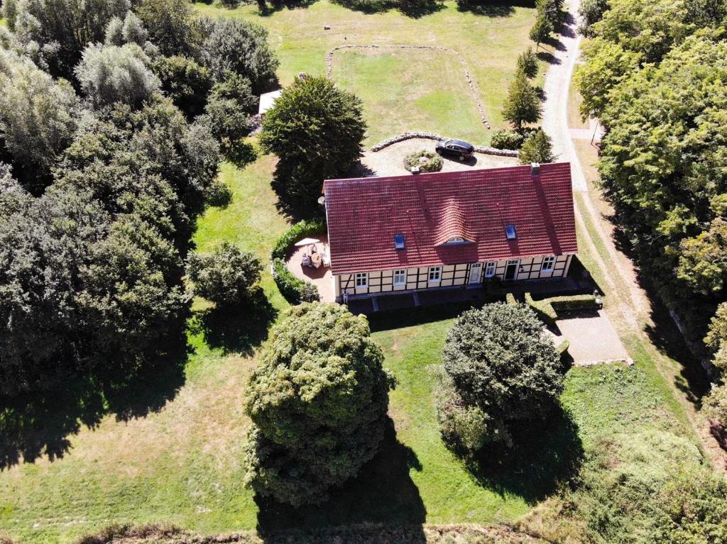 an aerial view of a house with a red roof at Altes Pastorat Schwichtenberg in Borrentin