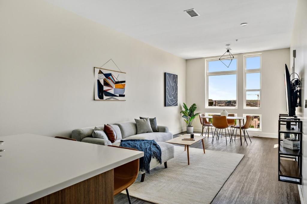 a living room with a couch and a table at A Denver Skyline State of Mind - Zuni Lofts in Denver