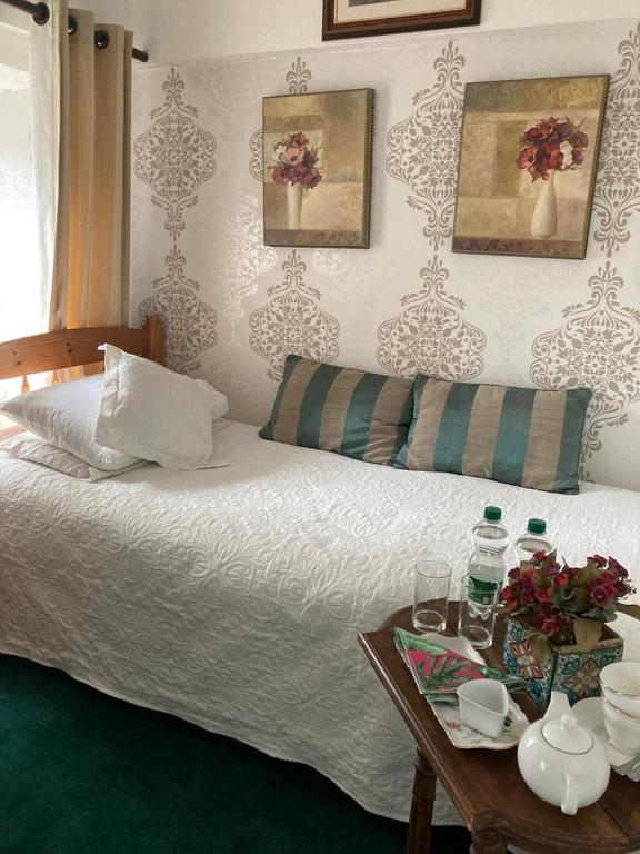 Postel nebo postele na pokoji v ubytování Ryan's Daughter B&B