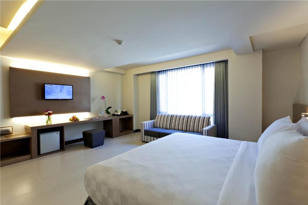 Tempat tidur dalam kamar di Euphoria Hotel