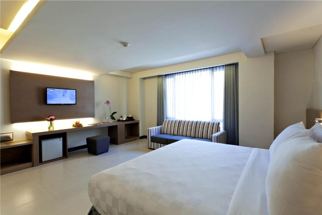 Postel nebo postele na pokoji v ubytování Euphoria Hotel