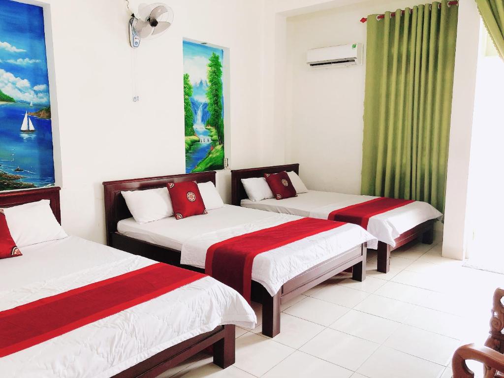 Postel nebo postele na pokoji v ubytování Đức Trọng Hotel