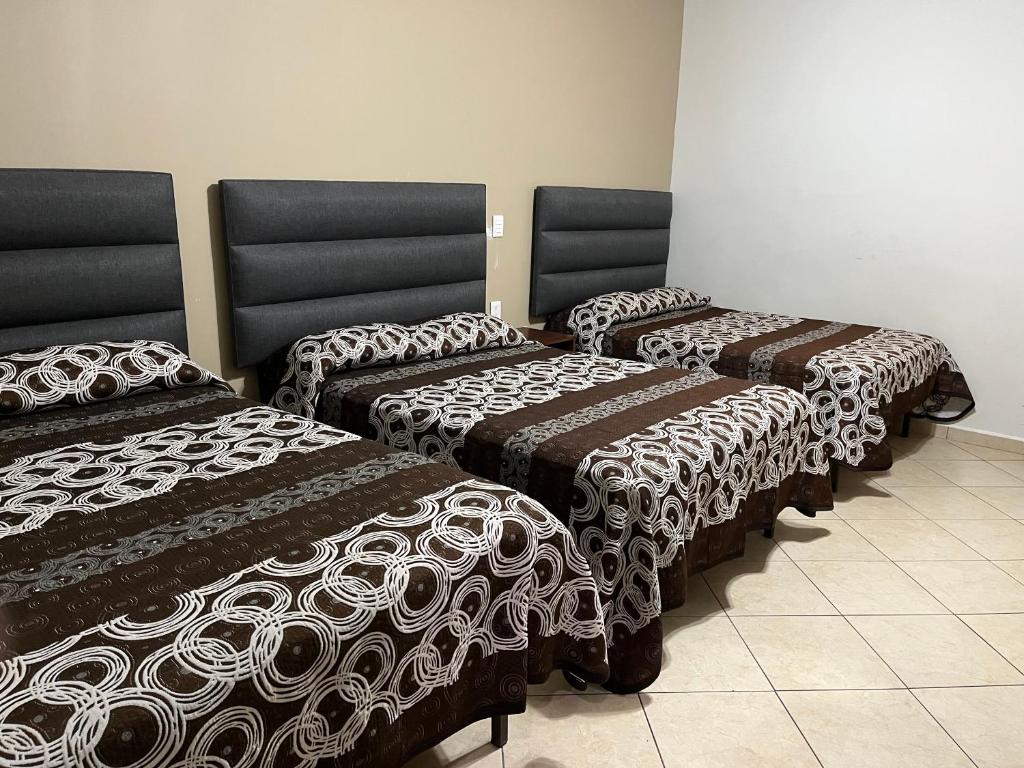 Postel nebo postele na pokoji v ubytování Hotel Posada Ruiseñor
