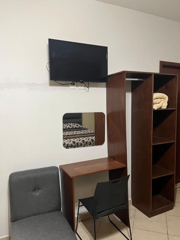 TV a/nebo společenská místnost v ubytování Hotel Posada Ruiseñor
