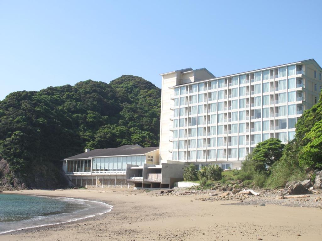 a hotel on the beach next to the ocean at Nichinankaigan Nango Prince Hotel in Nichinan