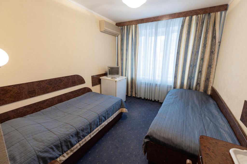 Postel nebo postele na pokoji v ubytování Hotel Mir