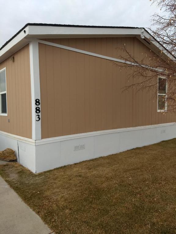 a house with a garage with the numbers on it at Curt's cozy room rentals in Wendover