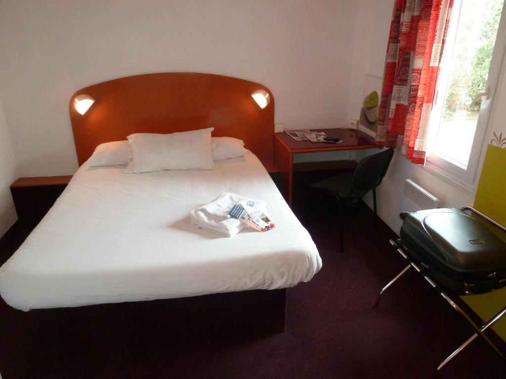 Postel nebo postele na pokoji v ubytování Hôtel Quick Palace Valence Nord