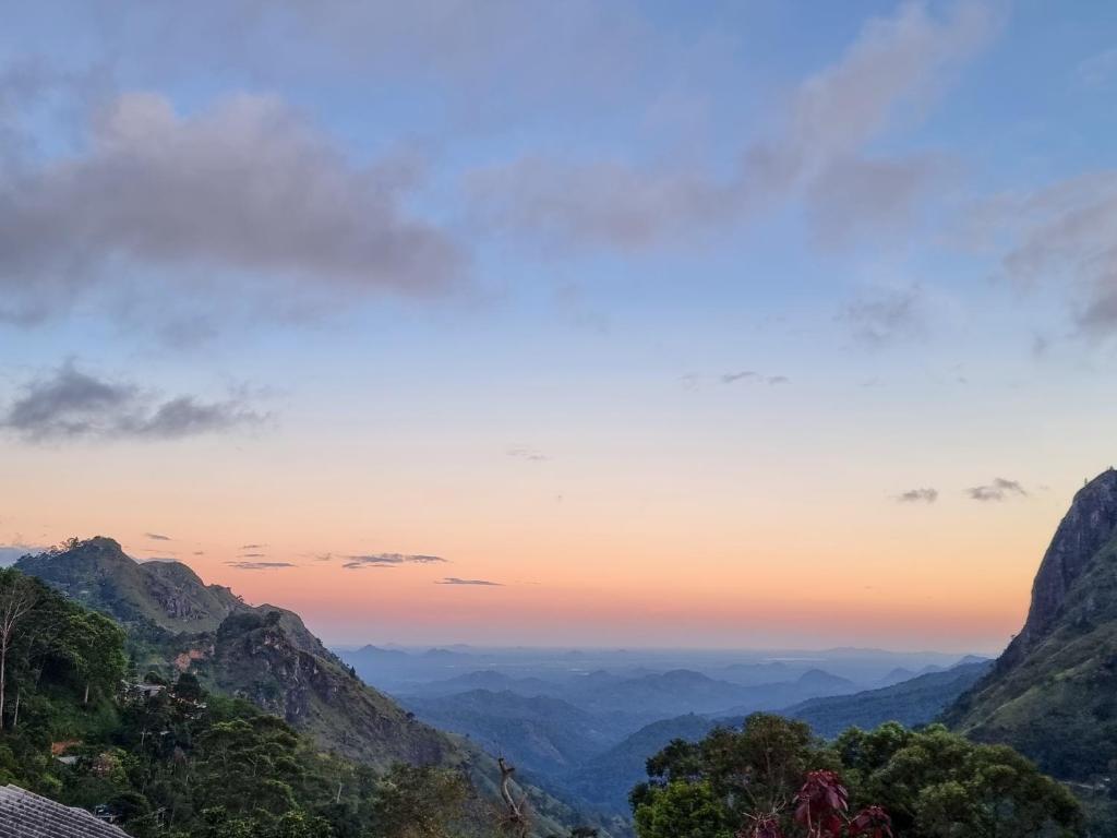 a view of the mountains at sunset at Hilltop Guest House in Ella