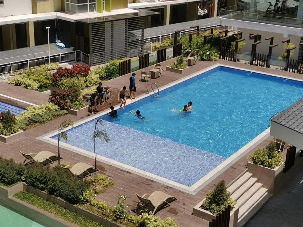 an overhead view of a swimming pool in a building at Room in Studio - Mesaverte Residences Afs Suites in Cagayan de Oro