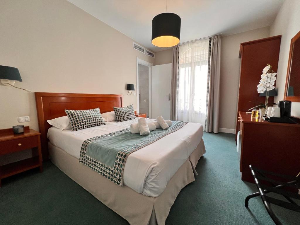 Postel nebo postele na pokoji v ubytování Hotel Olympia