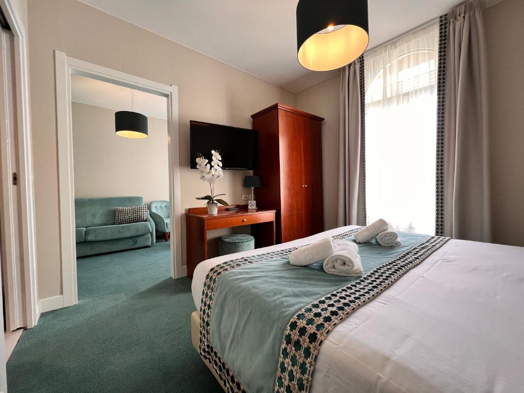 Postel nebo postele na pokoji v ubytování Hotel Olympia