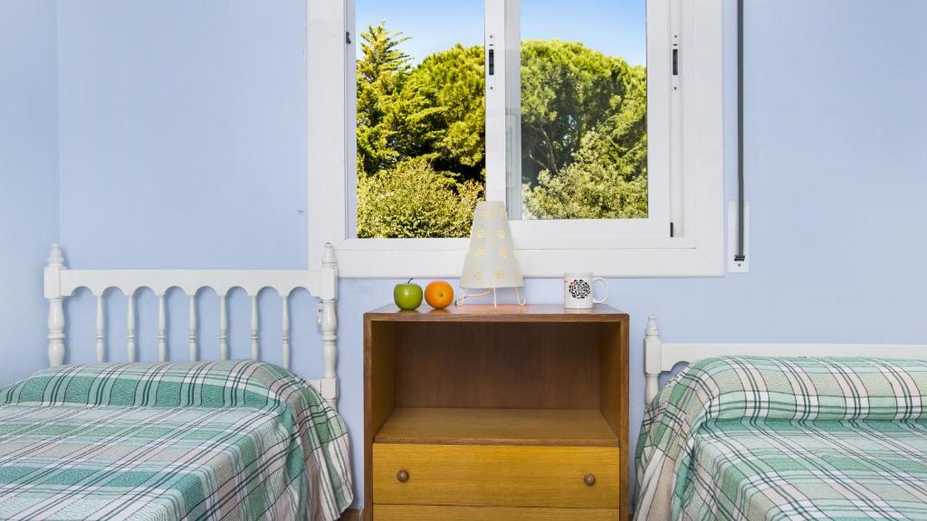 Postel nebo postele na pokoji v ubytování Roc 1D - Calella de Palafrugell