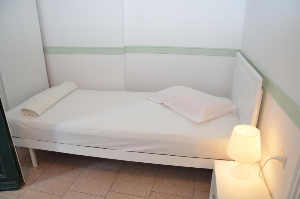 Postel nebo postele na pokoji v ubytování Aegli Rooms
