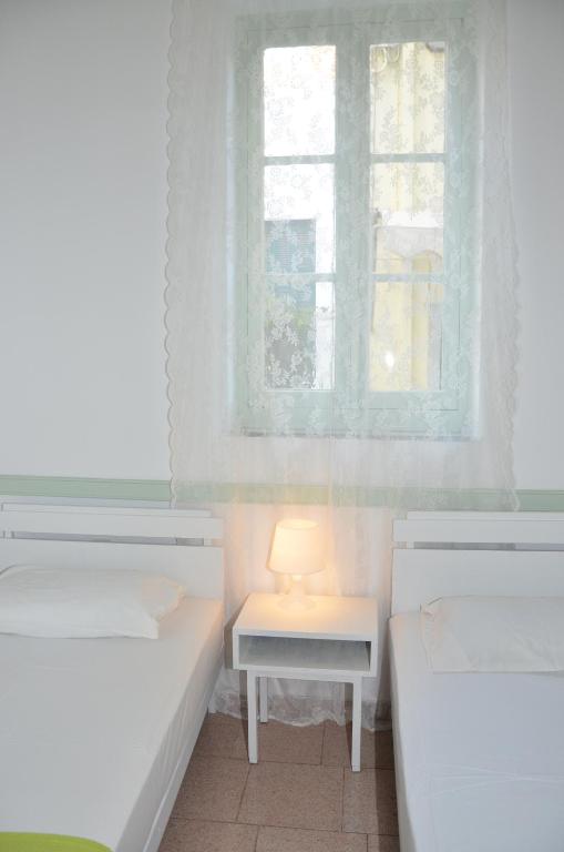 Postel nebo postele na pokoji v ubytování Aegli Rooms