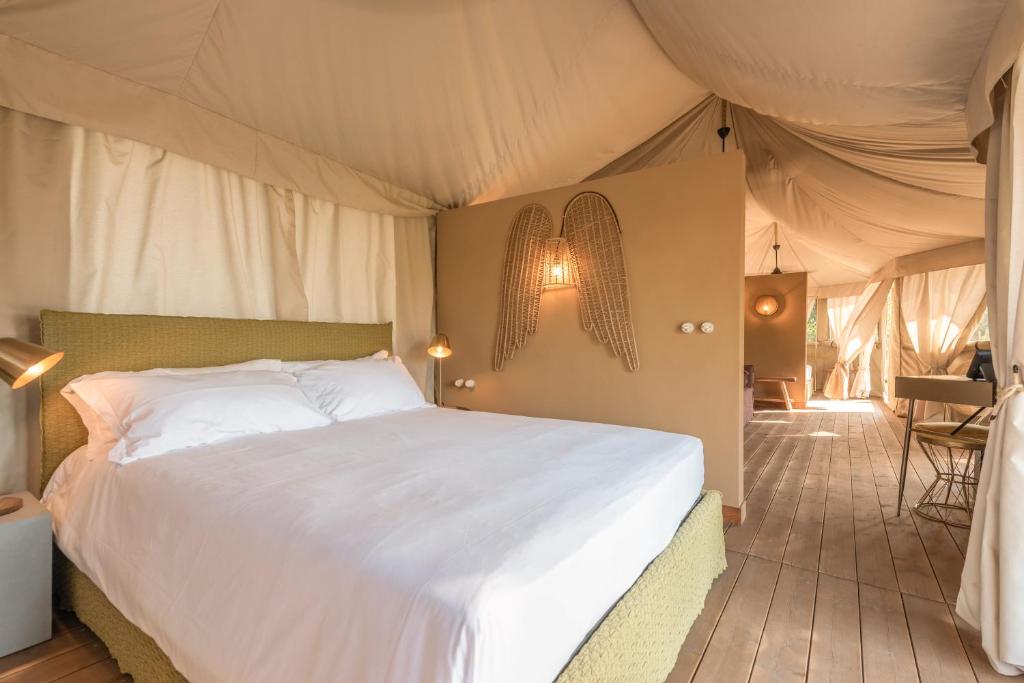 Voodi või voodid majutusasutuse Terme di Vulci Glamping & Spa toas