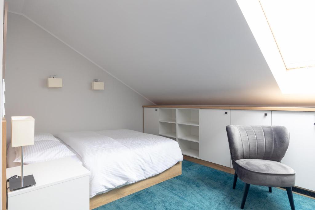 Posteľ alebo postele v izbe v ubytovaní Aparthotel Esencja Warszawy Nowy Świat