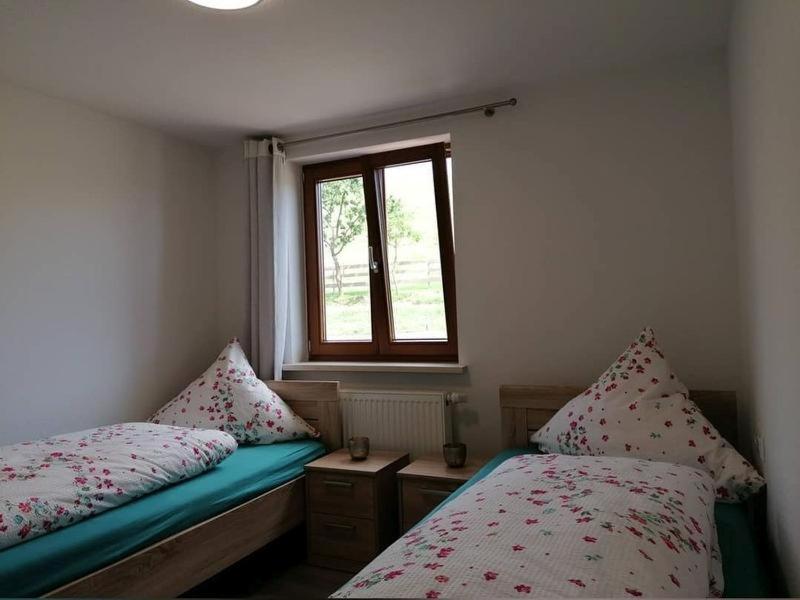 Postel nebo postele na pokoji v ubytování Stockerhof