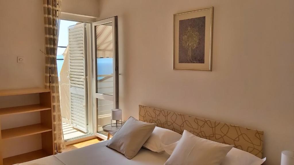 Postel nebo postele na pokoji v ubytování Apartment Juta